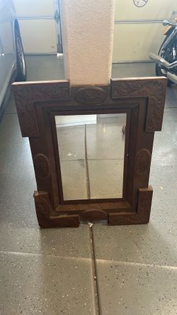 Mirror with metal frame