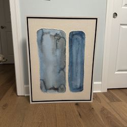 These reclaimed wood boards are distinguished by two strips of contrasting timber. For a modern spin, the serving board boasts a navy 100% plant-based