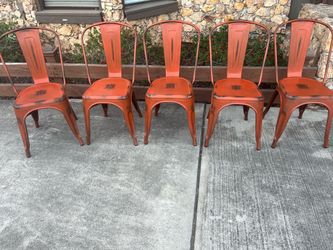 Orange metal chairs with worn design!