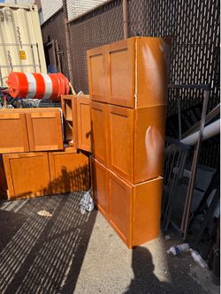 Used kitchen cabinets—upper and lower—in good condition.