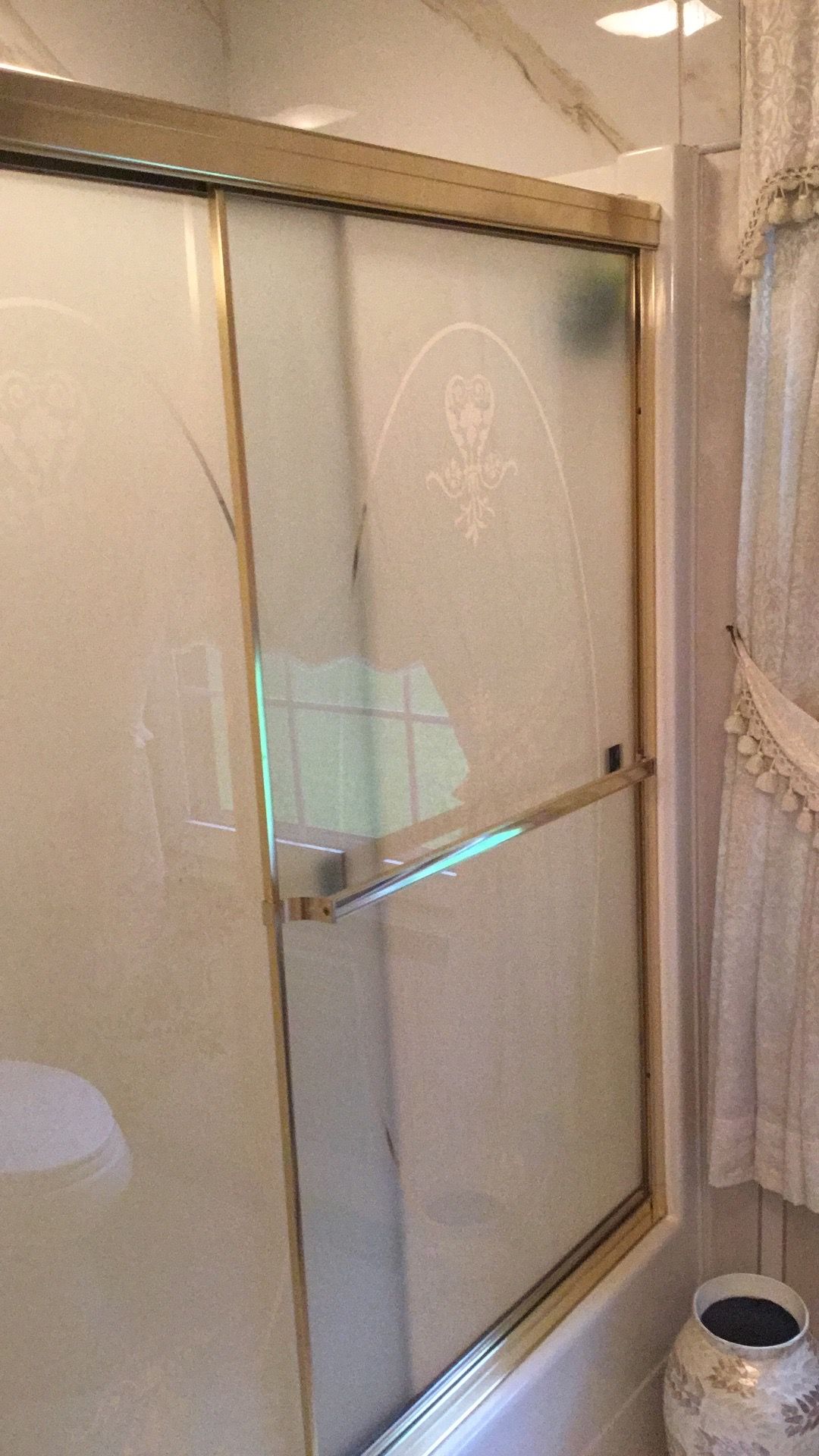 Gold sliding glass shower stall doors