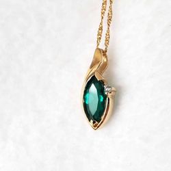 14k Yellow Gold Chain And Emerald Pendant With Diamond Accent