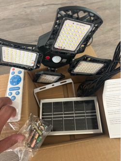 Solar Powered Motion Sensor Shed Light – 4 Adjustable Heads w/ Remote