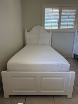 TWO WOODEN TWIN BED FRAMES AND MATTRESSES