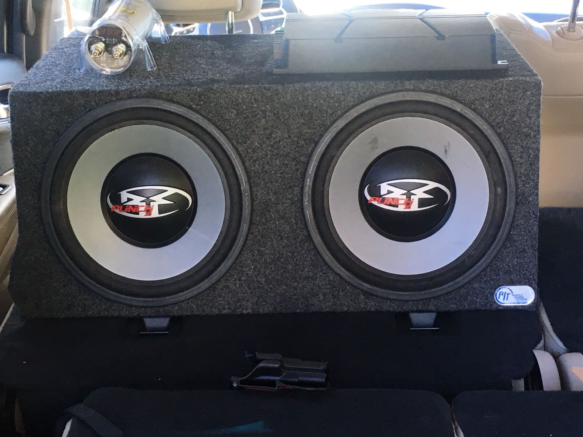 2 Rockford Fosgate 12" Subs with box, pioneer amplifier with bass boost, and 2 Farad capacitor.