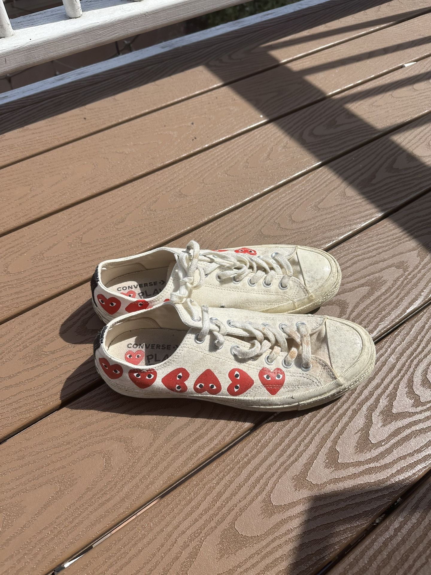 white cdg low top cons