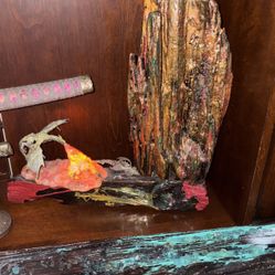 Driftwood with going in a dark epoxy, resin with a dragon that you light up that lights up at night for kids or any adult that loves dragons