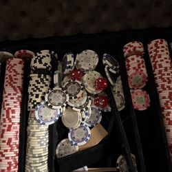 Complete poker set with a large assortment of casino-style chips in multiple colors and denominations, several red dice, and a sturdy carrying case. E