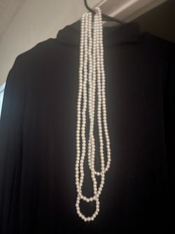 Beautiful long pearl necklace. Has multiple strands of white pearl beads. Great accessory for special occasions or just to dress up an outfit.