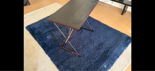 Blue rug and gaming desk