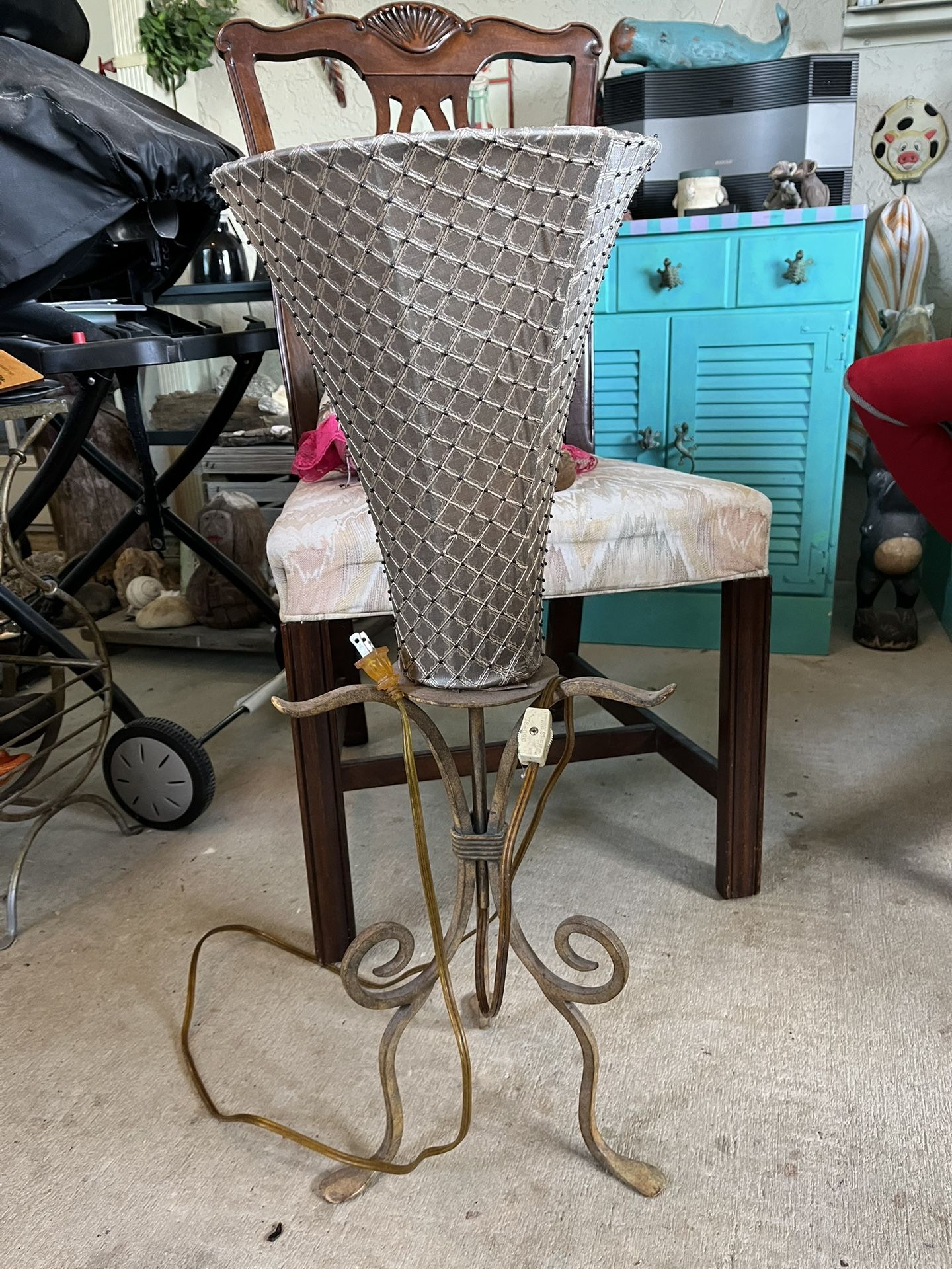 Antique Floor Lamp With Scrollwork Base And A Textured Shade