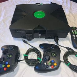 Microsoft Origional Xbox Console 2- Controller Cords, DVD Attachment And Remote With no battery Cover