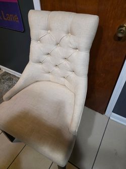 Eight white chairs