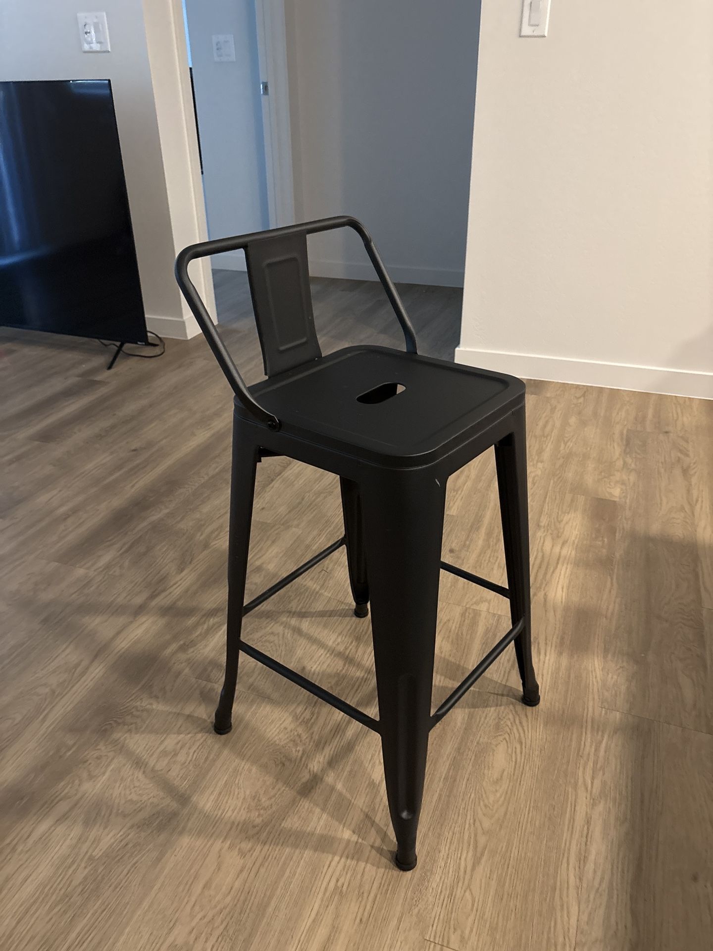 Black Tolix-style bar stools with a low backrest Set Of 4