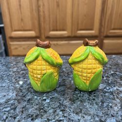 Vintage ceramic Corn pair of salt and pepper shakers.  Size approximately 3 inches tall.  Preowned good condition.  The white spots are from the ceili
