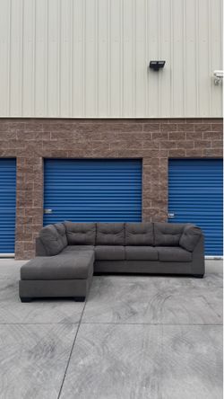 Ashley’s furniture grey sectional sofa couch with chaise