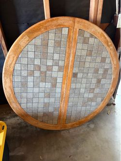 Hand tiled table with 3 wood chairs and leaf extension