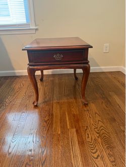 Dark brown wood side table