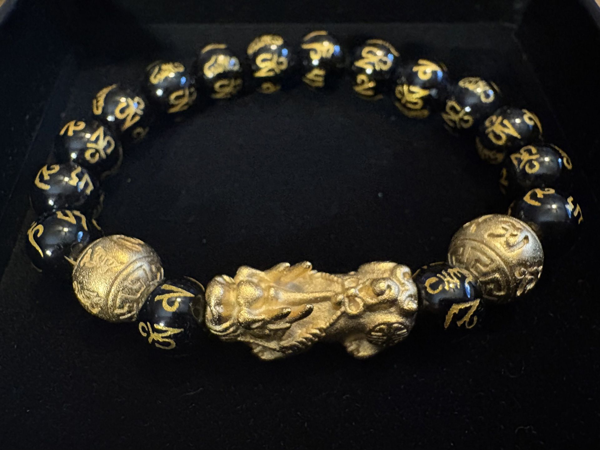 Buddha Power Feng Shui Pixiu wealth bracelet with black obsidian beads and a gold-colored Pixiu charm