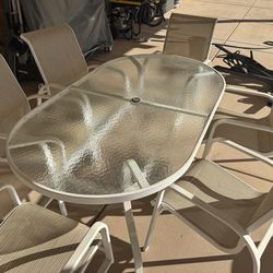 Outdoor powder coated glass-top table w/ six chairs