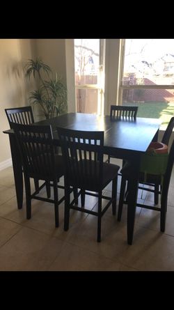 Wooden table with 5 chairs