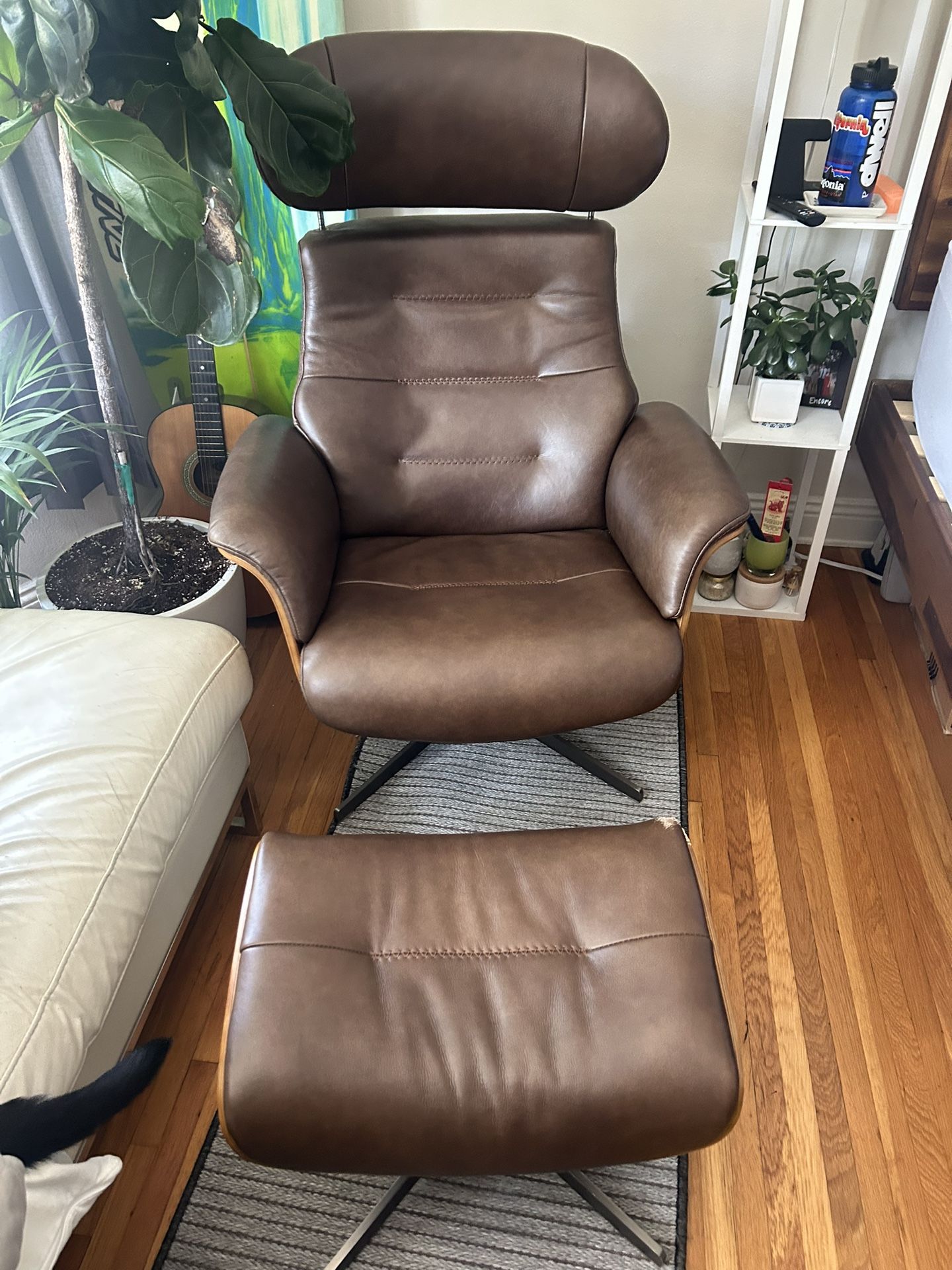 Leather swivel chair and ottoman