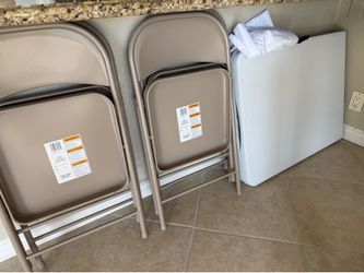 6 foot folding table and 4 chairs