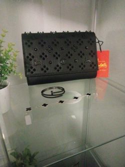 Christian Louboutin Purse , ( Latest) Cartier Nail Bracelet, and  Van Cleef Black  and Silver Bracelet 