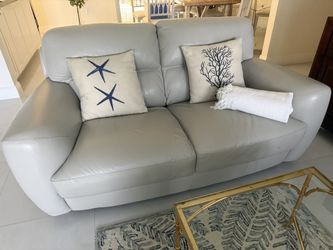 Light gray leather sofa and love seat