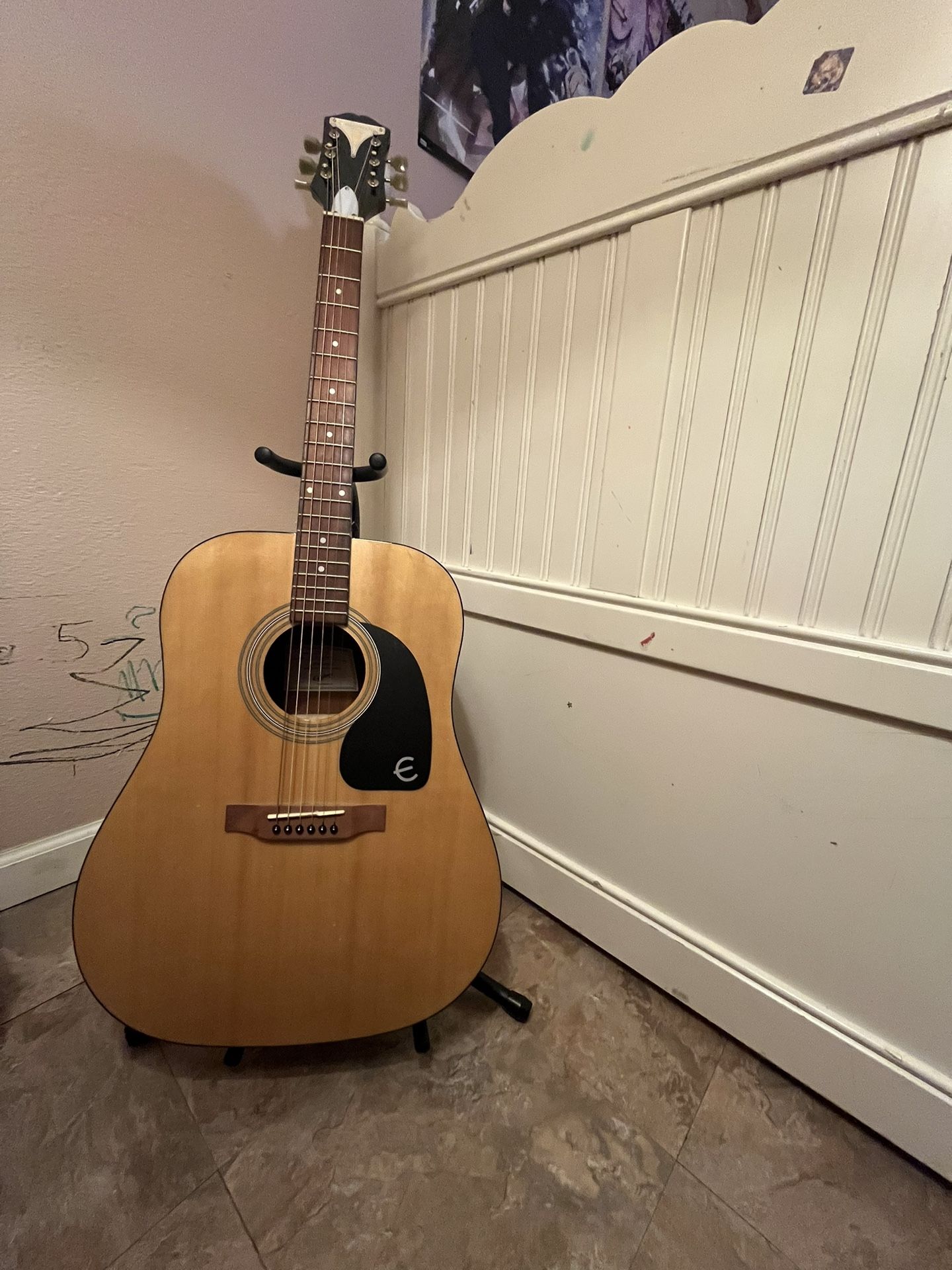 Acoustic Guitar (along with guitar Stand and Extra Strings)