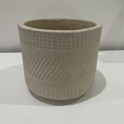 Cream-colored ceramic plant pot