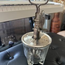 Vintage A&J hand-crank egg beater with a glass measuring bowl 