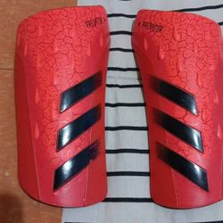 Red and Black Adidas Predator Shin Guards