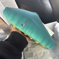 001 teal Nike Mind slide