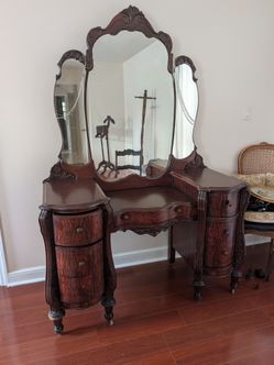 Antique Vanity with a three-panel swinging mirror