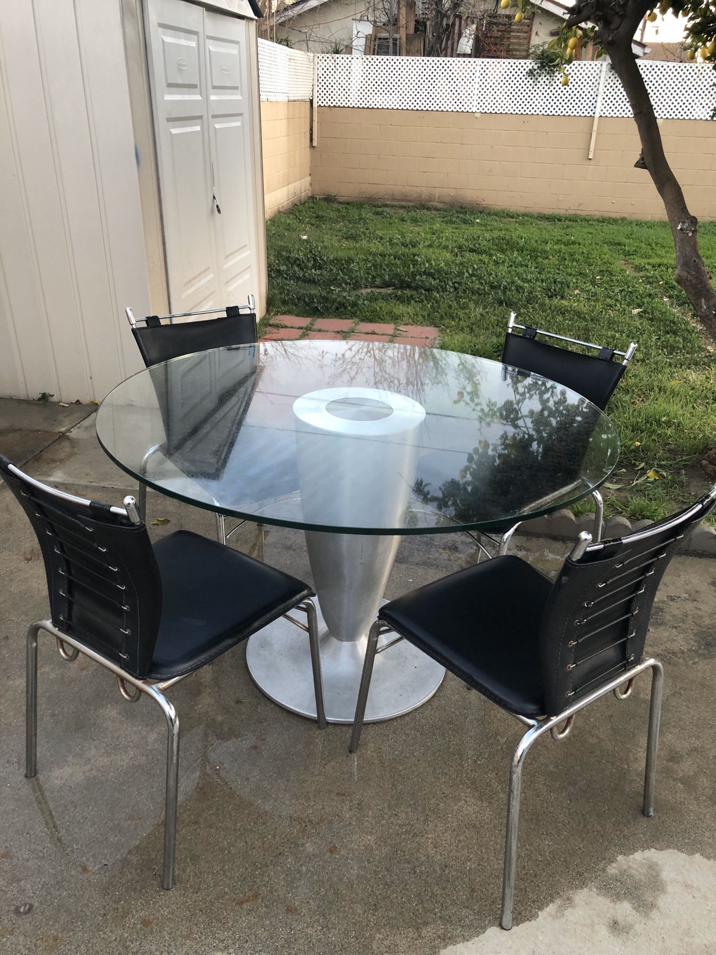 Dining glass table with four chairs