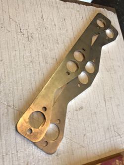 Stainless SBC small block Chevy Round Port Exhaust Header flanges.