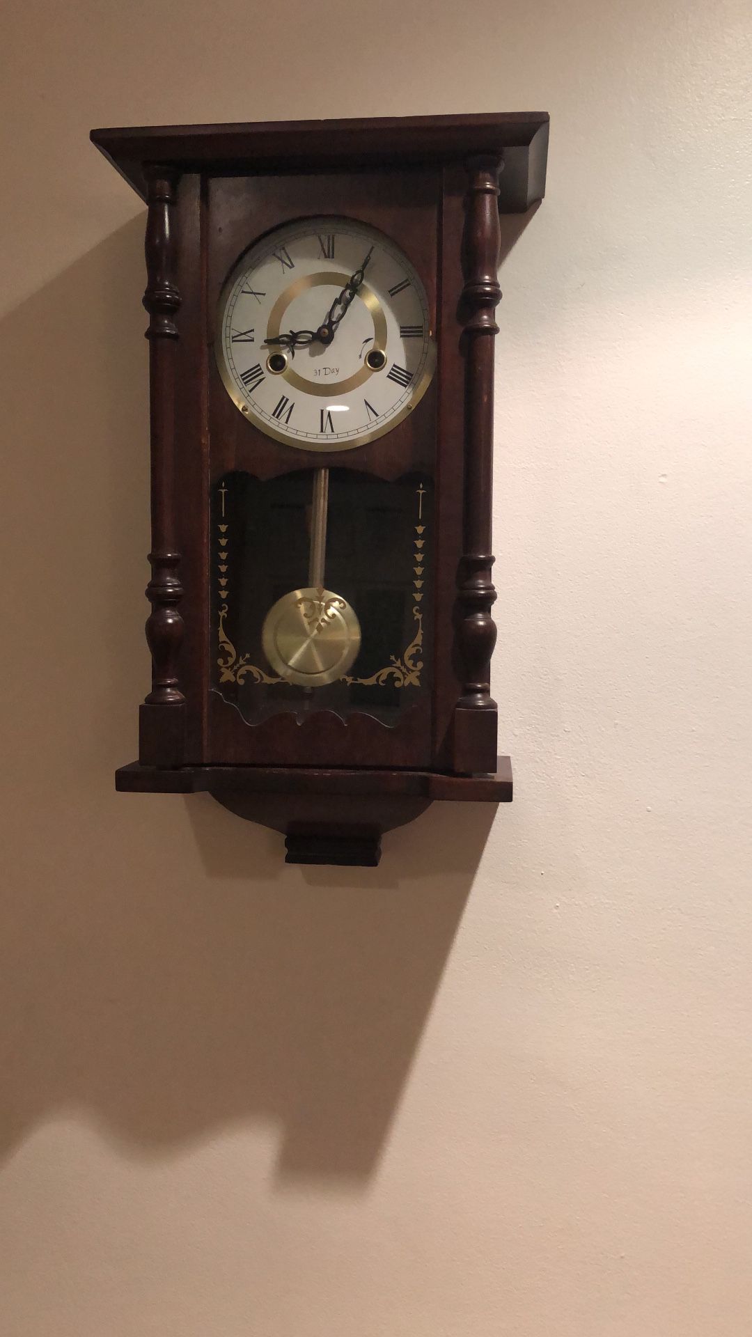 Wall clock with pendulum antique