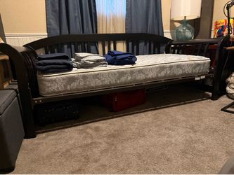 Hillsdale Furniture Dorchester daybed featuring a black finish and a curved sleigh design including mattress two sets of sheets & one comforter set. G