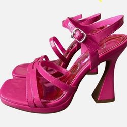  Fuchsia faux patent leather Architectural covered heel Strappy dress sandals Adjustable ankle strap with buckle closure Cushioned insole Approximate 