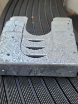 4 Simpson Strong-Tie SS1.5 16-gauge galvanized steel stud shoe designed to reinforce notched or drilled vertical wall studs in nominal 2x lumber