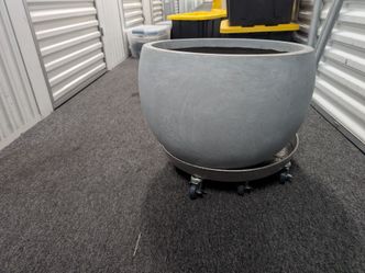 large concrete planter w/ metal rolling tray
