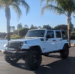 2014 JEEP WRANGLER UNLIMITED HIGH ALTITUDE EDITION SPORT UTILITY 4X4