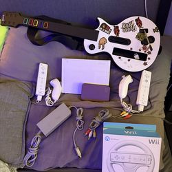 White Nintendo Wii guitar hero set
