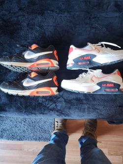 2 pairs of Nike air maxes size 9.5 and size 10 black ones
