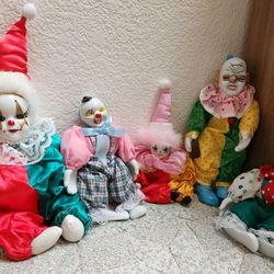 Clowns with porcelain heads and hands.