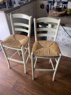 Two white high chairs