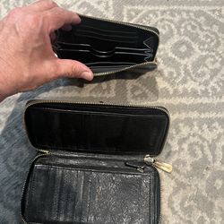 Two leather Michael Kors wallets-used