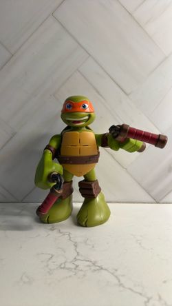 Playmates Teenage Mutant Ninja Turtles Michelangelo figure from the 2012 Nickelodeon series.