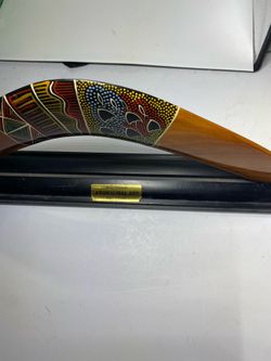Wood boomerang on stand
